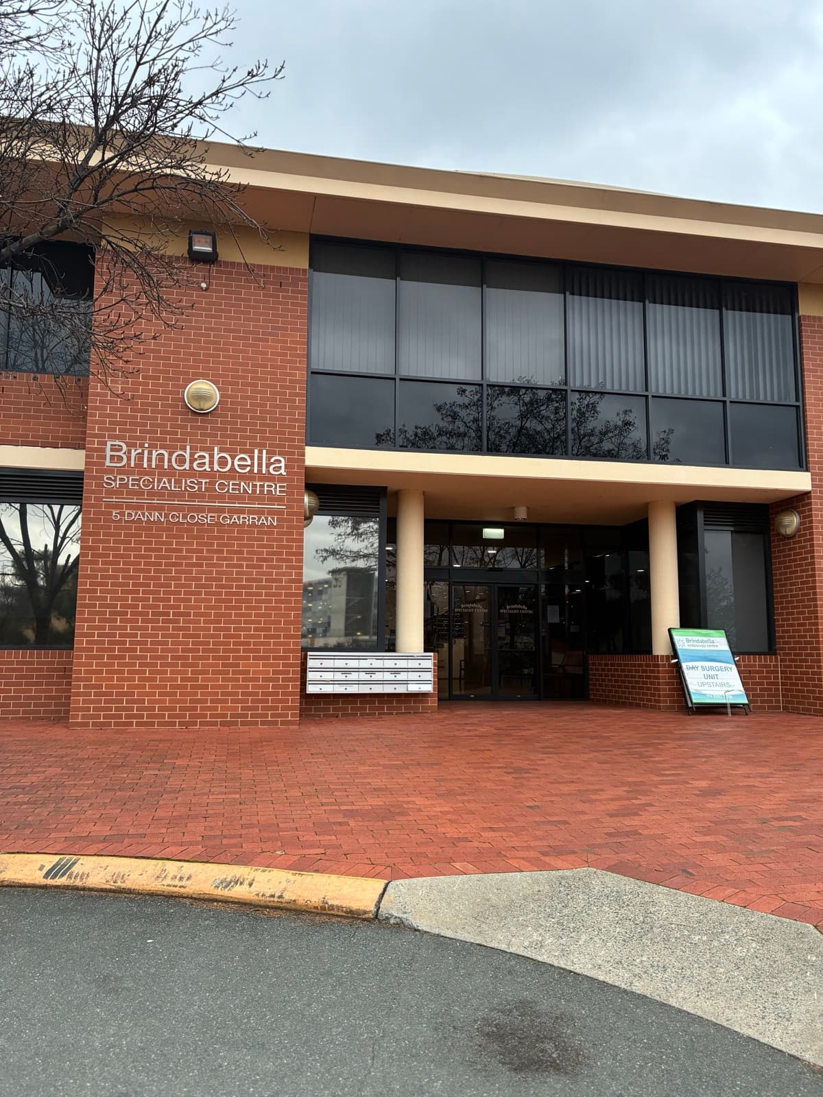 The Brindabella Specialist Centre at 5 Dann Close, Garran — a red-brick building with a covered front entrance.