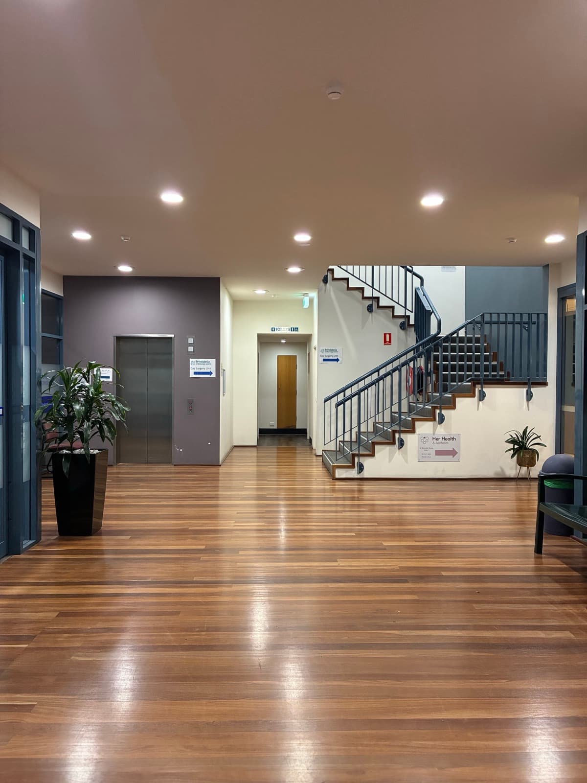Ground-floor foyer of the Brindabella Specialist Centre showing the lift on the left and the staircase on the right.